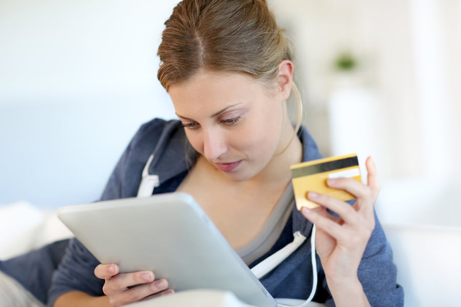 Closeup of blond girl doing online shopping