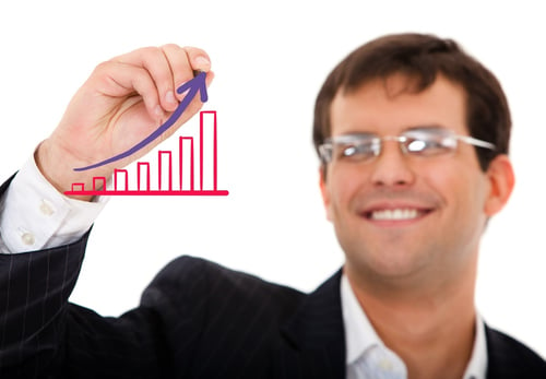 business man drawing a growth graph isolated