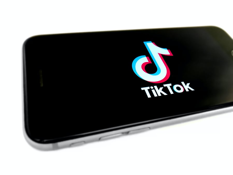 Image of TikToc graphic on phone screen.