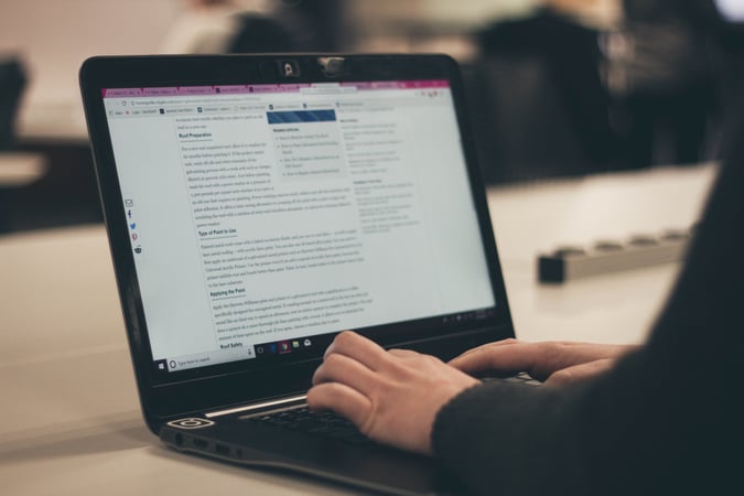 adWhite More Than Just an SEO Boost, Blog Posts Can Lead to Purchases Person Sitting at Laptop Blogging